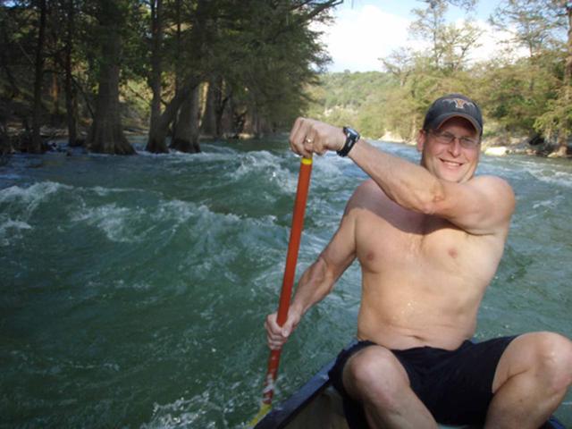 Paddler in a canoe on the rapids