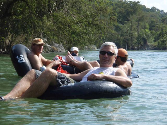 Friends relaxing in tubes on the Guadalupe River