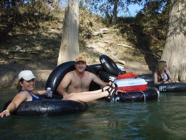 Tubers relaxing by the cypress trees